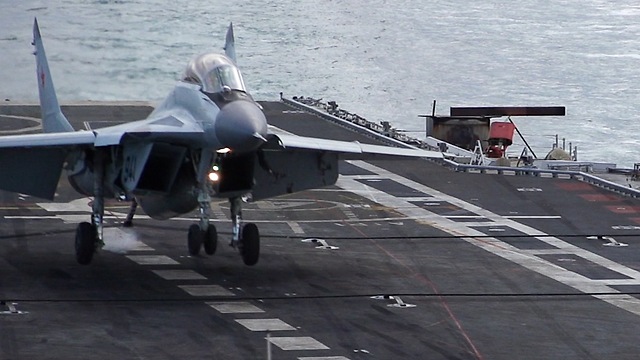 Slow Motion Footage Captures Jet Fighter Landing On Aircraft Carrier