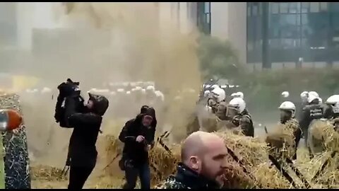 Dutch farmers bombarding police with hay and manure.