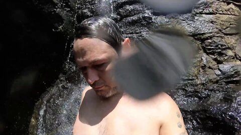 Under the mini waterfall!