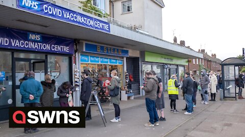 Footage shows queues outside a vaccination centre as bookings for booster open to over 18s