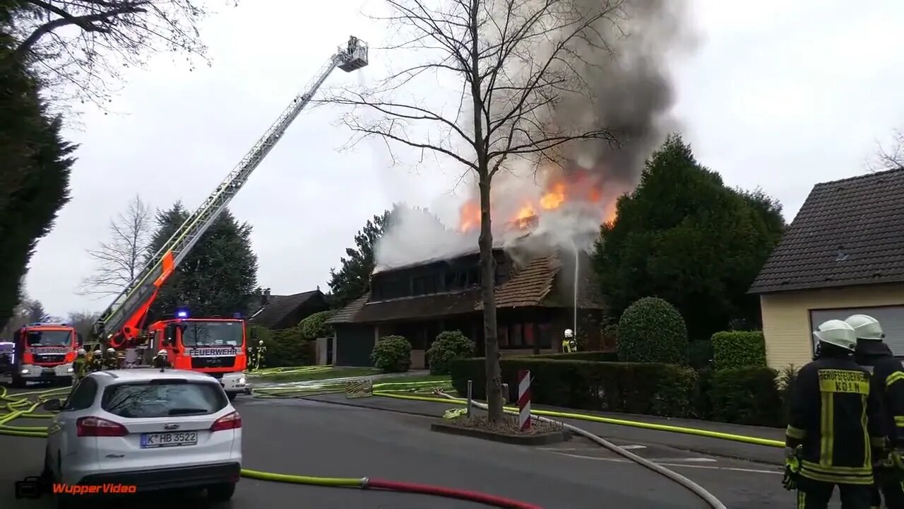 3. Smoke billows from thatched cottage fire