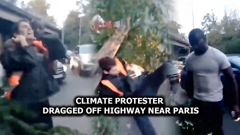 Climate protester dragged off highway near Paris
