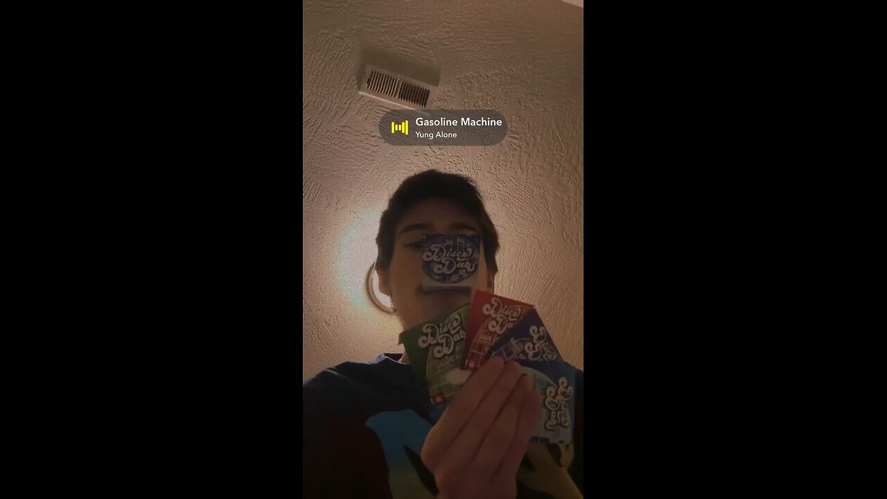 Yung Alone showing his old disco dabs packaging before they changed it while listening to song