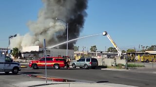 Flames engulf vacant building west of I-15 in Las Vegas