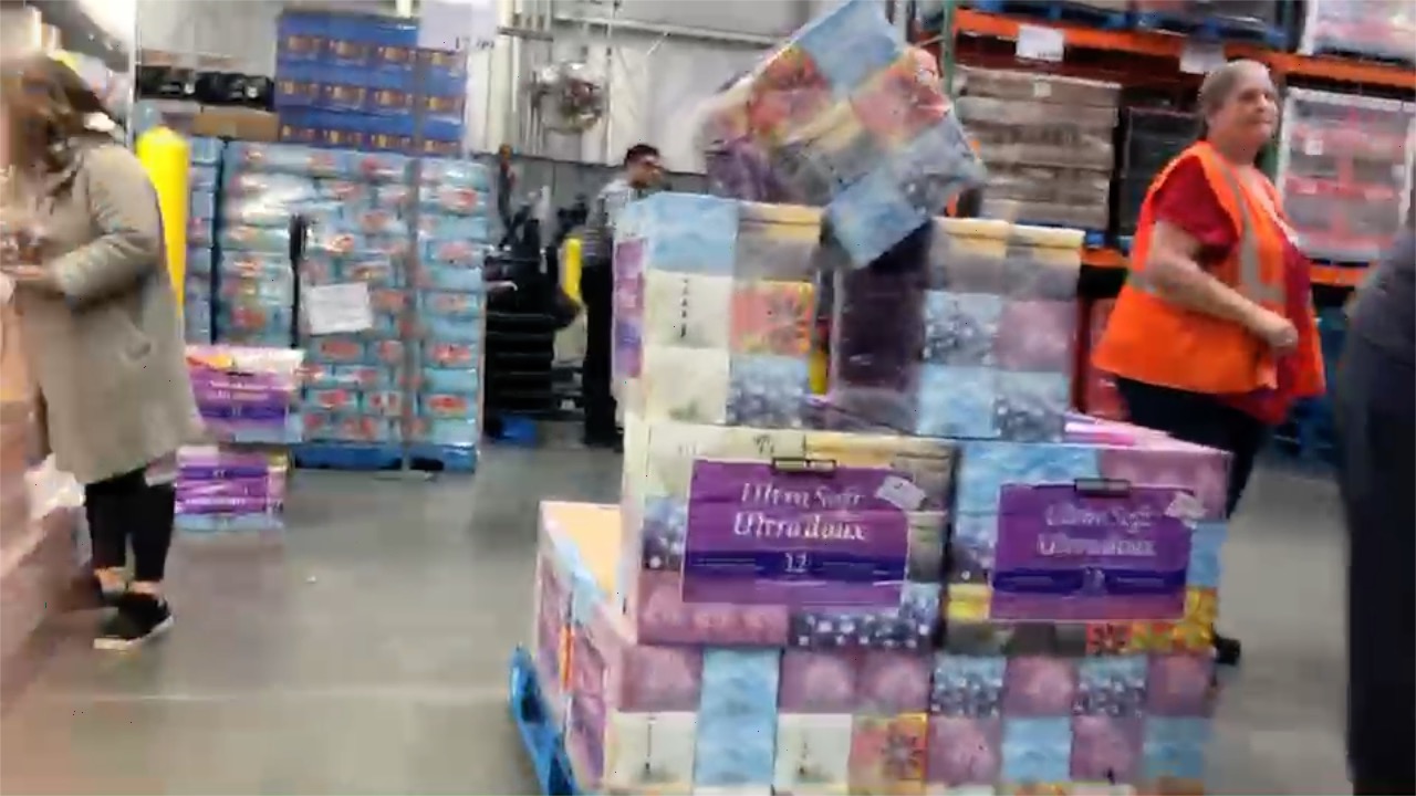 Coronavirus continues to cause extreme lineups, store employees guard toilet tissue supplies