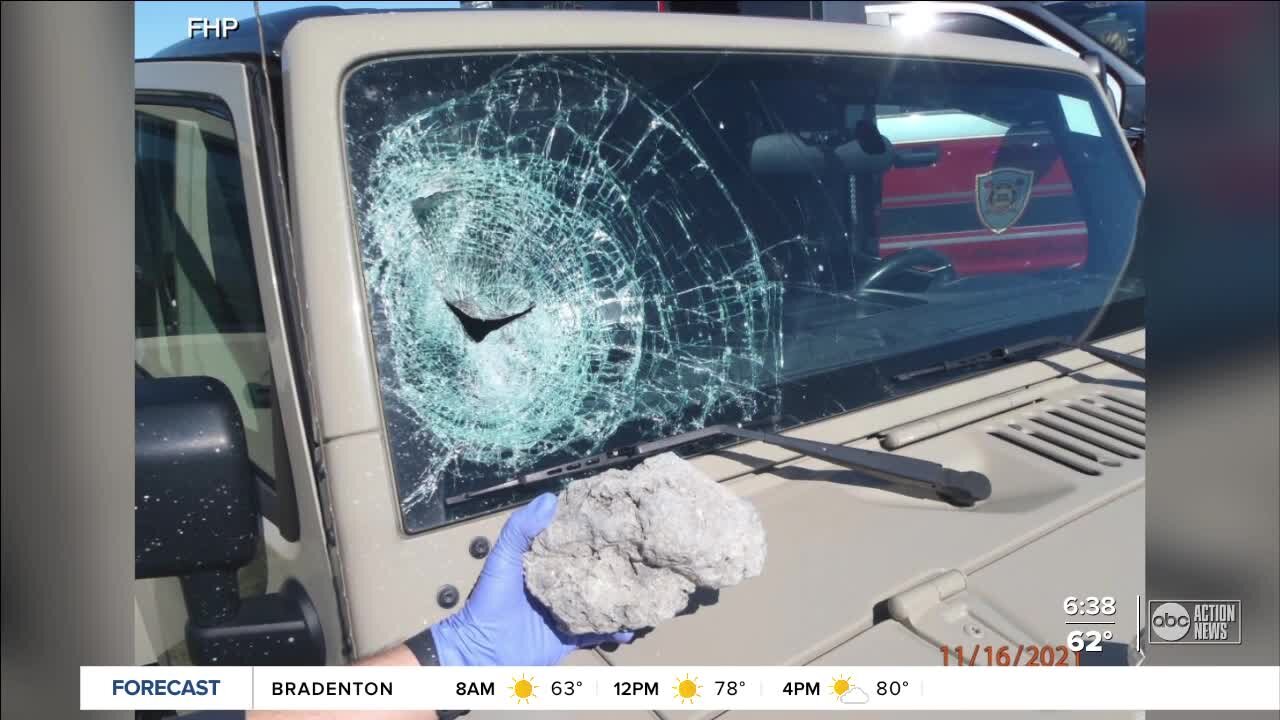 Large rock crashes through Jeep windshield on I-75