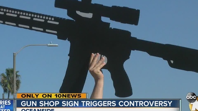 Gun shop sign triggers controversy