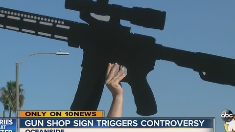 Gun shop sign triggers controversy