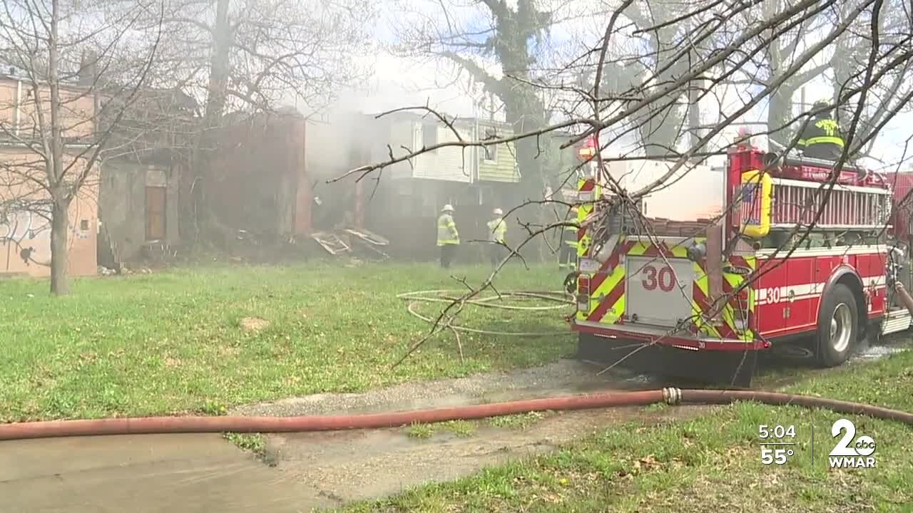 Two-alarm fire rips through several Baltimore homes, leaving person hospitalized