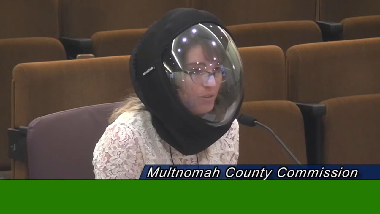 WOMAN WEARS UNUSUAL HELMET AT CITY COUNCIL MEETING, UNFAZED BY COVID'S END