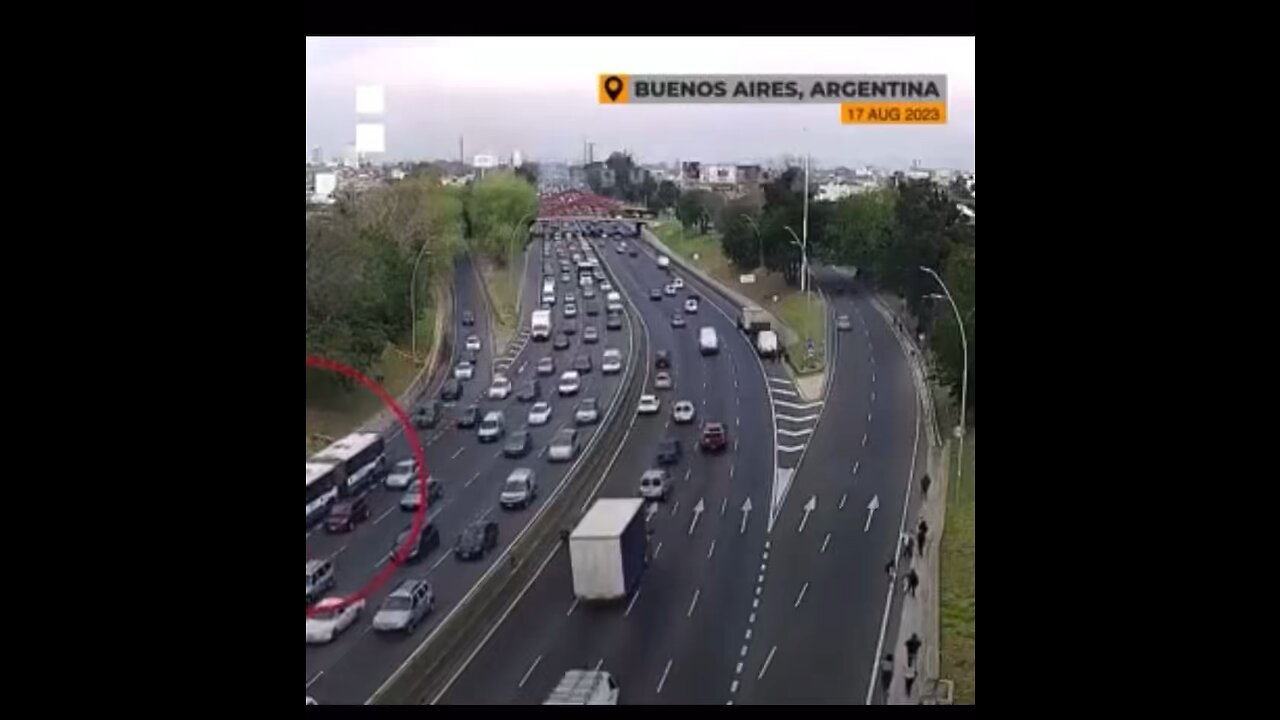 Cars were seen driving through burning fuel which spread across a highway in Argentina after a bus