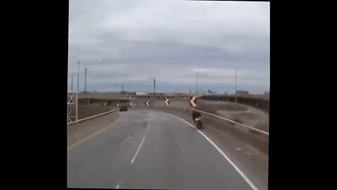 motorbike rider hits barriers and flies over it while his bike keeps riding.