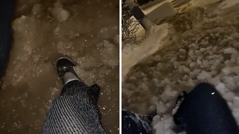 Woman falls in deep slush, ends up sliding down hill