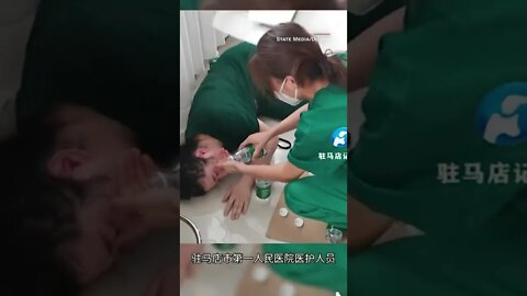 Chinese state media videos show Covid workers collapsing on the job due to the scorching