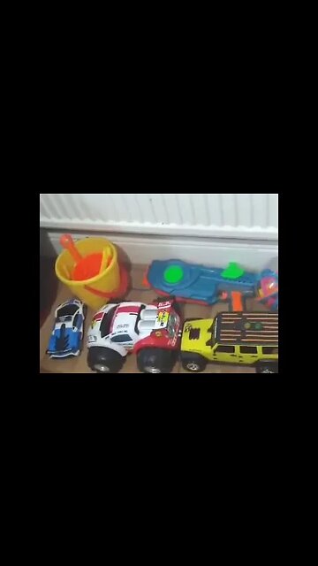 Baby boy and his sisters are watching Barney the bear