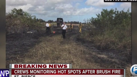Crews monitoring hot spots after brush fire