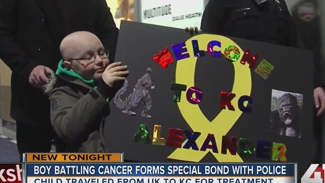 Police greet UK child battling cancer at KCI