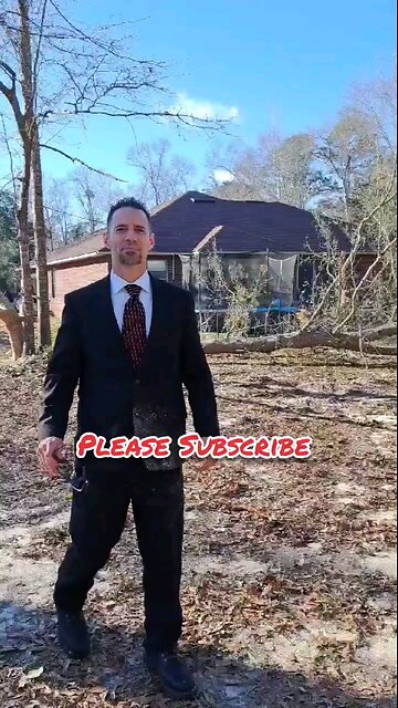 Dude in nice suit drops tree super close to house.