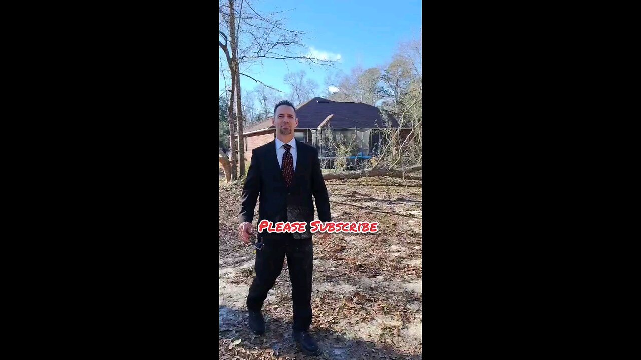 Dude in nice suit drops tree super close to house.