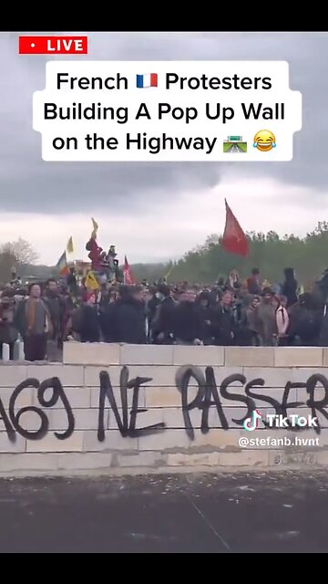 French protesters build a wall on the highway