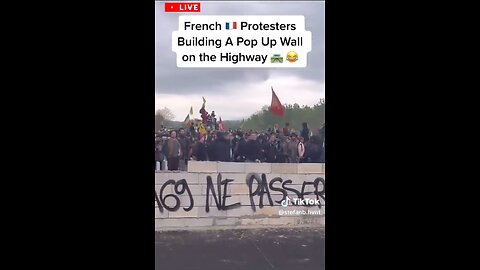 French protesters build a wall on the highway