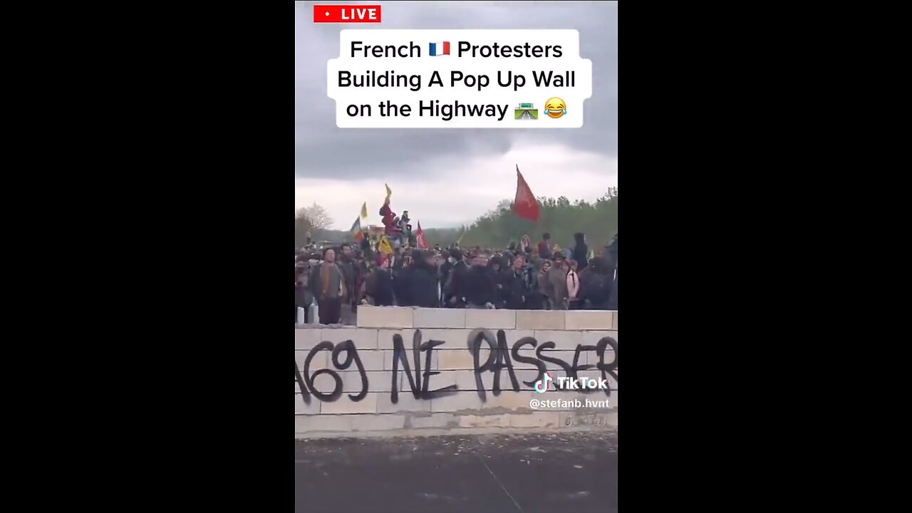 French protesters build a wall on the highway