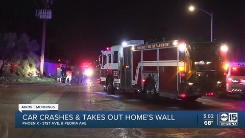 Car crashes near 31st and Peoria avenues, taking out wall