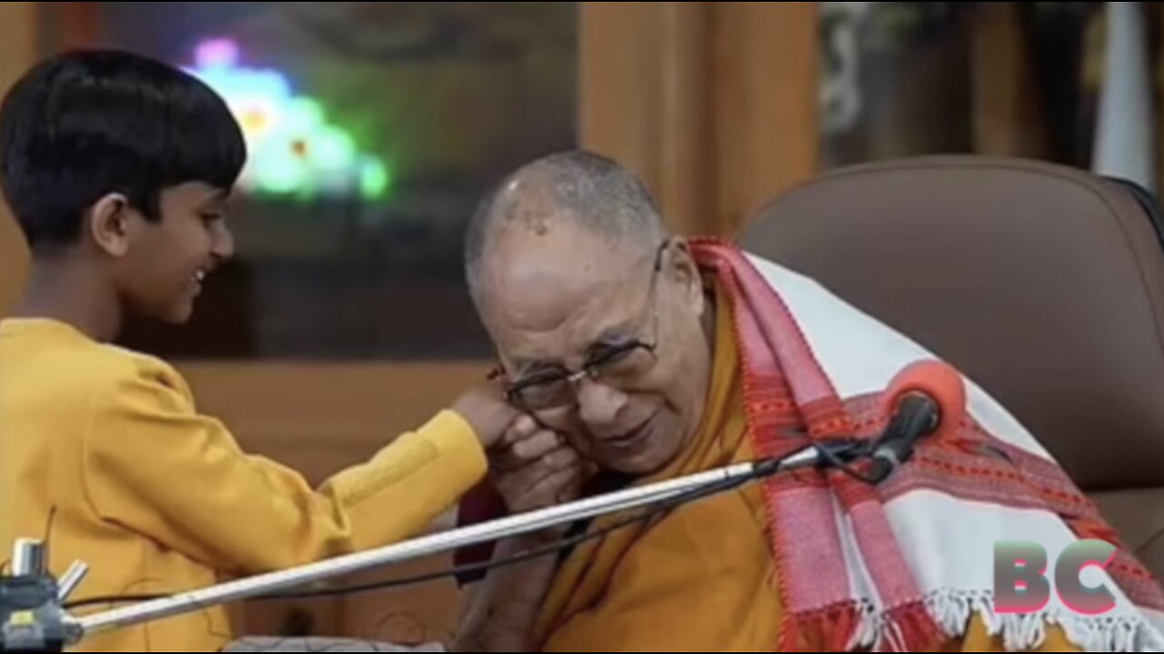 Dalai Lama apologises after kissing young boy on the lips