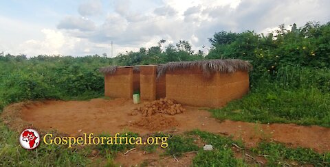 Constructing a mud house the same way it has been done for centuries in Wast Africa.