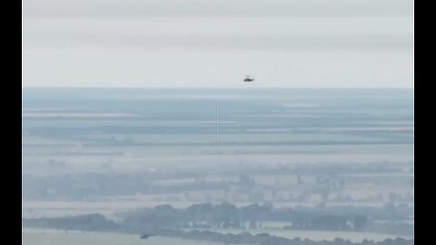 Russian Ka-52 attack helicopter long range shot on Ukrainian armoured vehicle