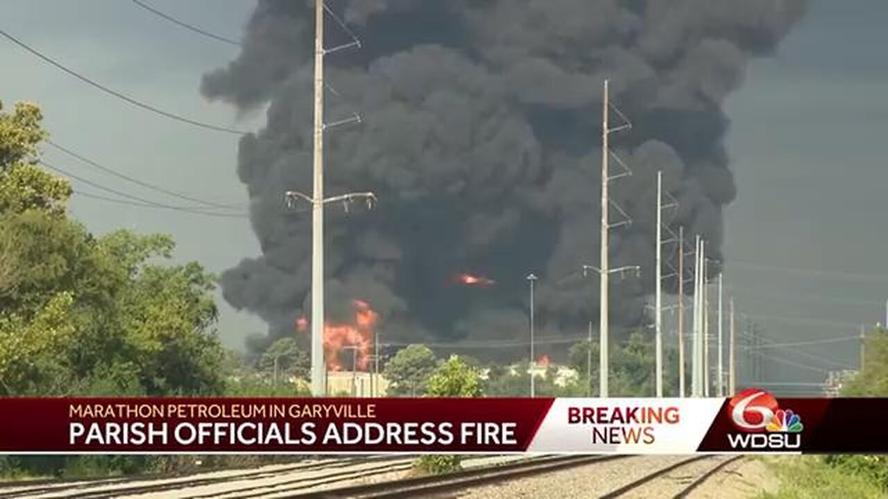 CREWS ARE WORKING TO EXTINGUISH FLAMES NEAR A TANK ON THE MARATHON REFINERY SITE IN GARYVILLE