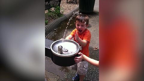 A Little Boy Vs A Drinking Fountain