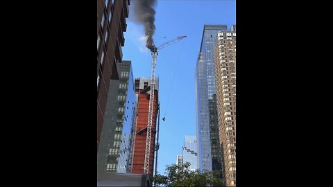 Crane catches fire and collapses down onto a neighborhood
