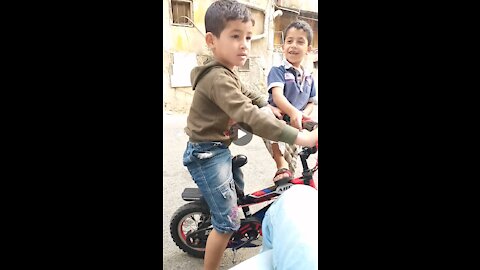 Children playing with the bicycle