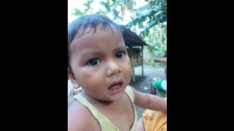 Baby playing with plastic bottles