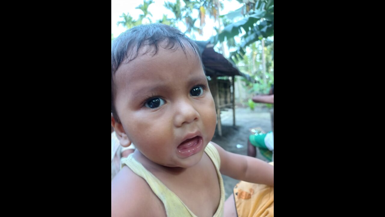 Baby playing with plastic bottles