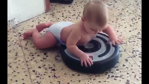 Children ride on a robot vacuum cleaner