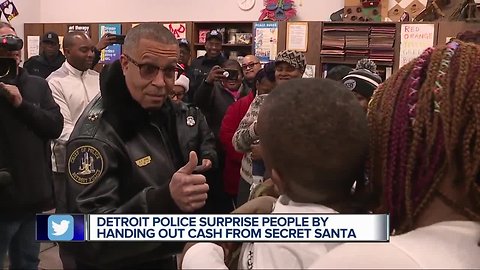 Detroit police surprise people by handing out cash from Secret Santa