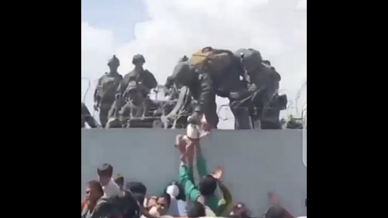 Mother hands over her baby to the Marines