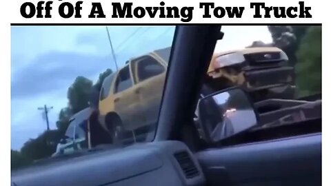 Guy steals back his car off a moving tow truck!