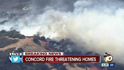 Concord fire threatening homes