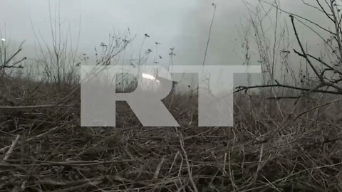 DPR fire ‘Grad’ multiple rocket launcher system at targets near Mariupol.