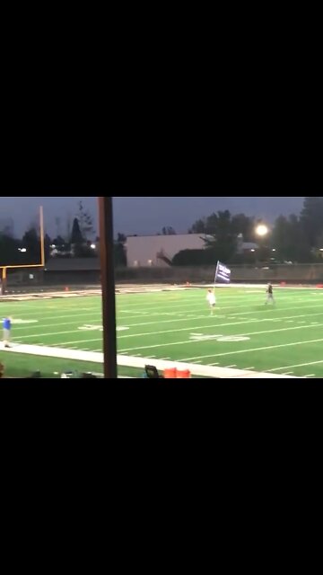 trespassed for running down the field with a Trump flag