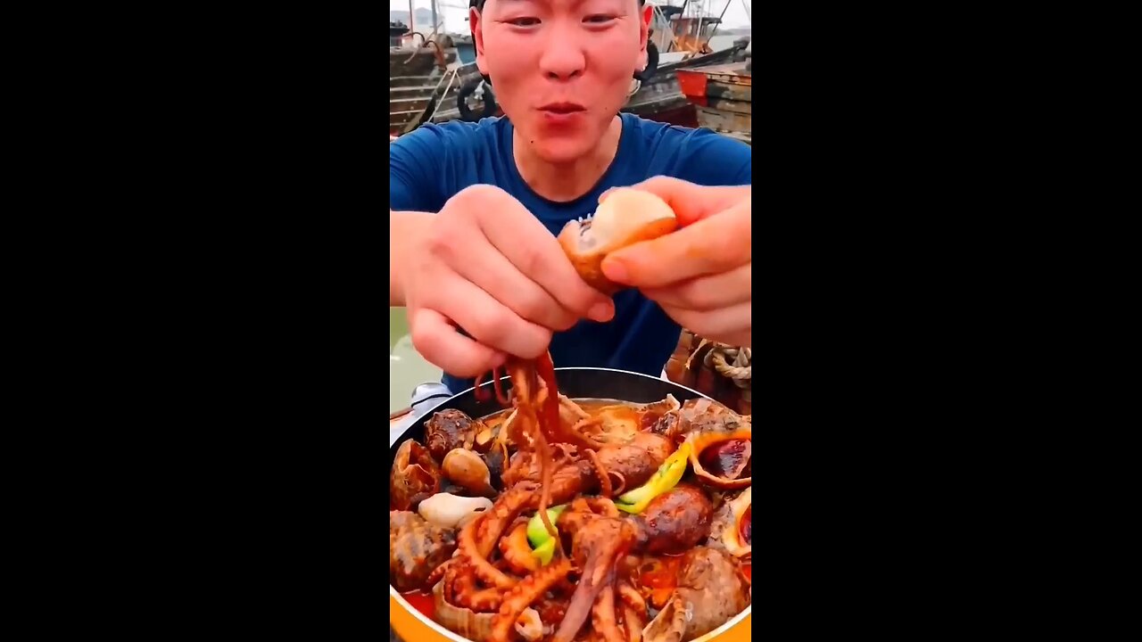 Chinese man eating seefood