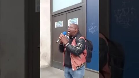Brother Leon preaching the gospel in Oxford Circus, London.