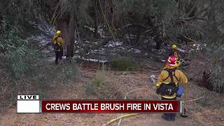 Crews battle brush fire in Vista