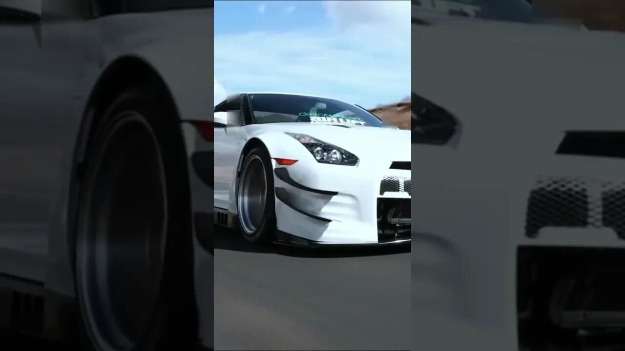 silver lamborghini and white gtr