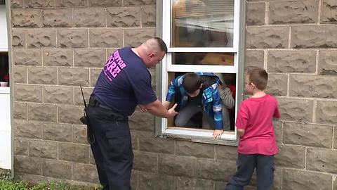 Mentor kids escape smoky room for a special fire drill