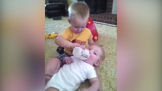 Tot Boy Loves To Bottle Feed His Baby Brother But Doesn’t Like Kissing Him