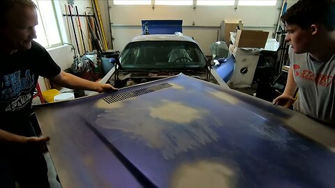 Attaching The Hood Of A 1981 Camaro